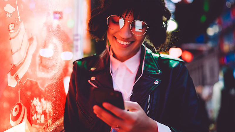 person standing next to large screen of Vodafone training